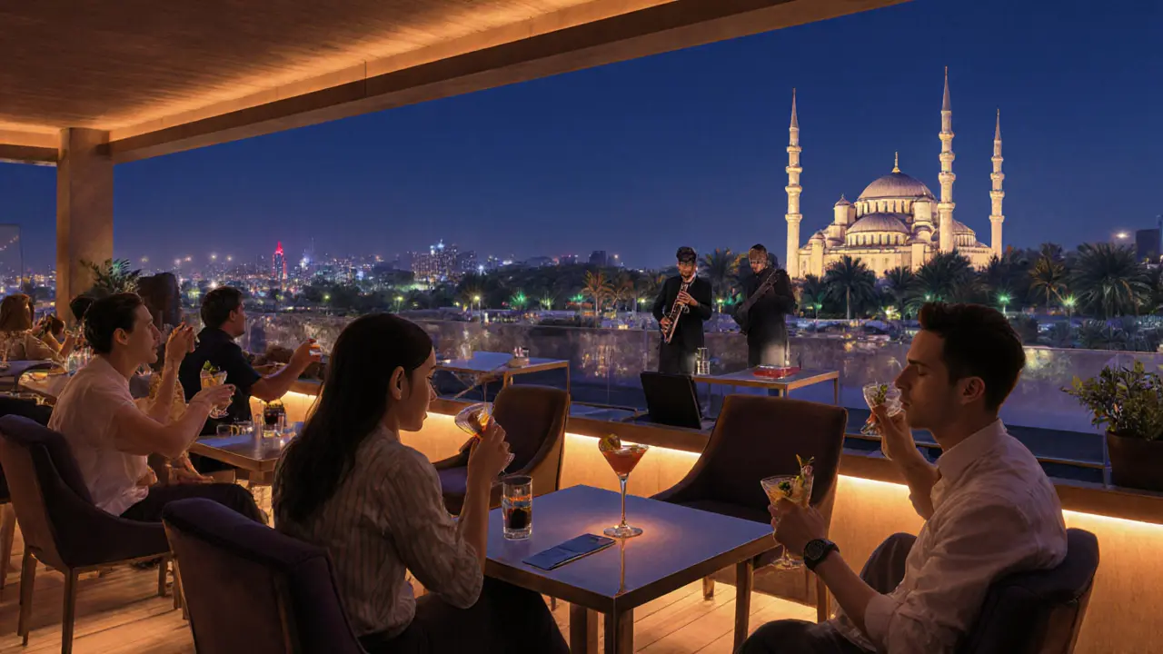 Guests enjoying quiet cocktails on a rooftop lounge with views of the illuminated Sheikh Zayed Grand Mosque.