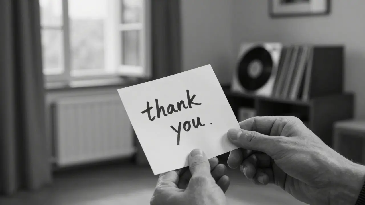 Hands exchanging a handwritten note in a cozy villa interior with vinyl records in the background, no faces shown.